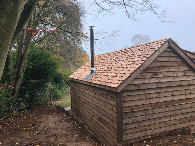 Chimney for the Log burner in a garden cabin, with cedar roof, Surrey/Sussex.