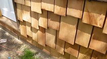 Tile hung cedar log cabin