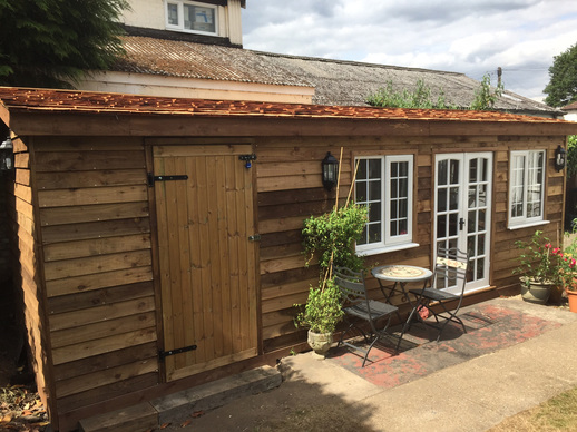 Addlestone  - Bespoke  Cabin with store shed
