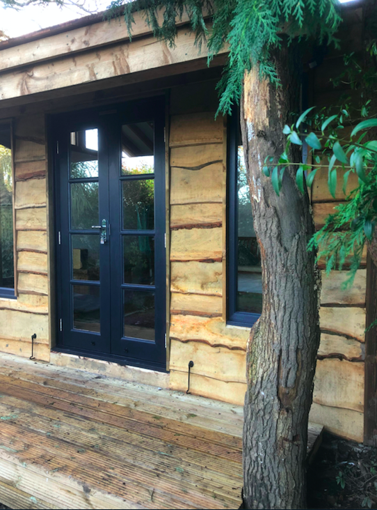 Rustic Oak Garden Building with Elm tree trunks supporting porch - West Sussex