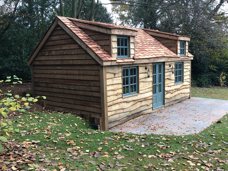 Insulated Oak timber garden house with cedar roof and patio. Surrey/Sussex